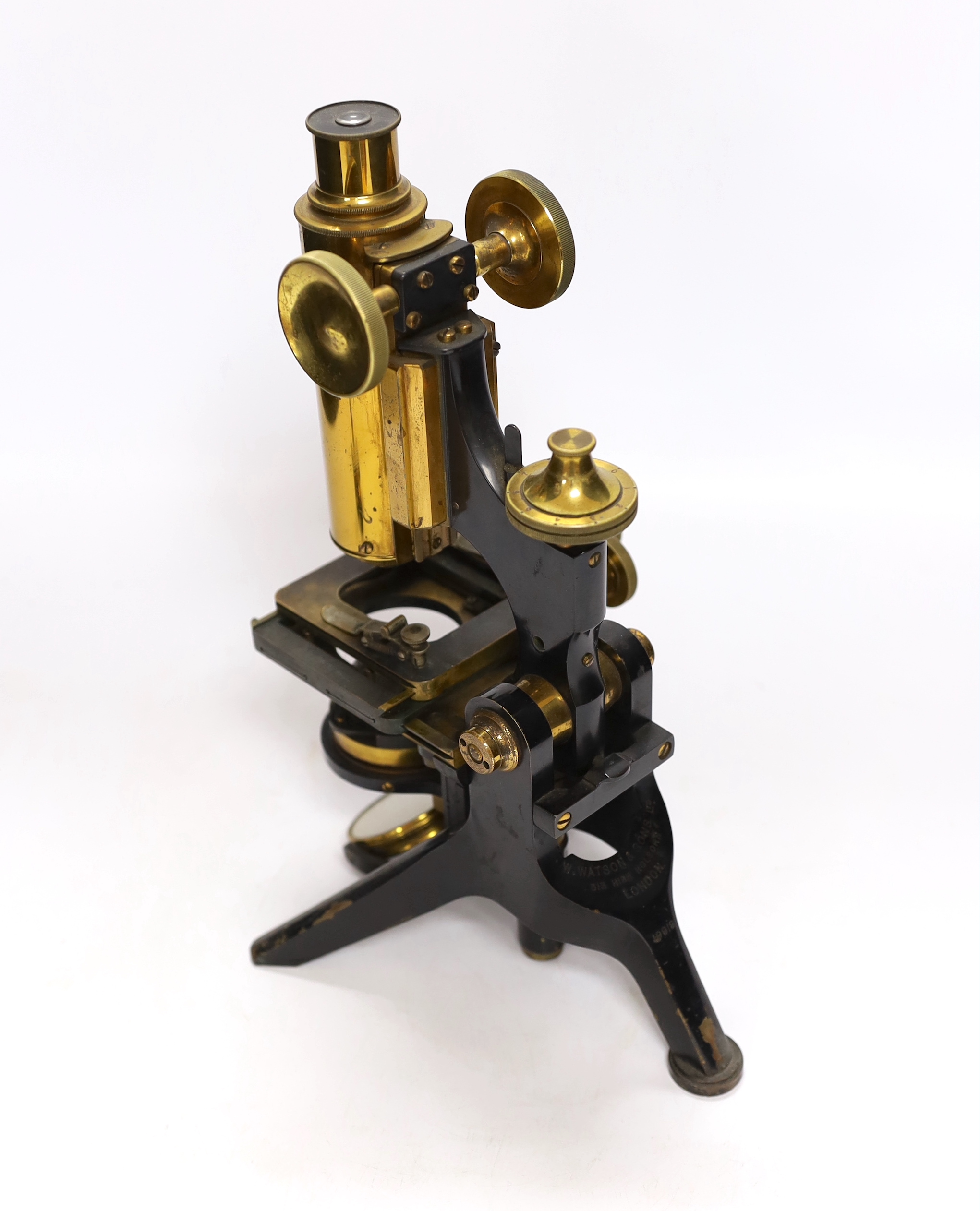 A Victorian monocular brass and black enamel microscope by W. Watson & Sons, High Holborn, in a mahogany carrying case, Serial no.19919, with a number of alternative lens of different magnification, case 34.5cm high